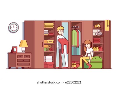 Young couple man and woman dressing up in home wardrobe room. Big closet or dresser full of clothes, boxes, household things. Interior design concept. Flat style vector isolated illustration.