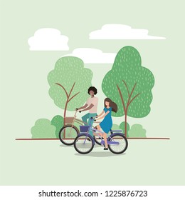young couple on bicycle in the park