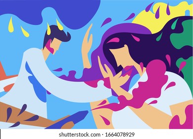 Young couple playing with coloured powder during Holi festival