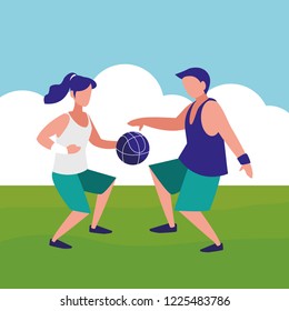 young couple playing soccer