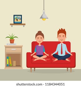 young couple practicing yoga on the sofa