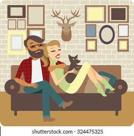 Young Couple Relaxing On Sofa In New Home