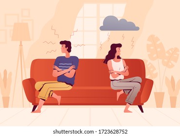 A young couple sits on opposite sides of the couch and quarrels. People spend time at home. The psychological concept of family quarrel and misunderstanding. Home conflict