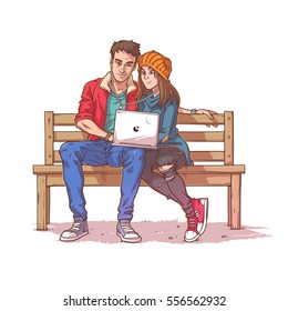 Young couple sitting on a bench and listen to music