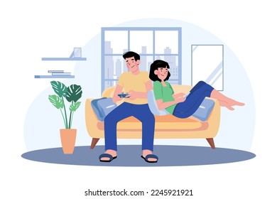 Young Couple Sitting On The Sofa Playing A Game