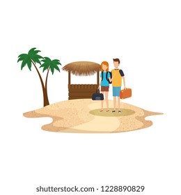 young couple with suitcase on the beach