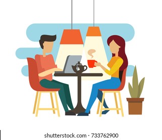 Young couple talking and drinking tea in cafe.