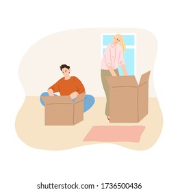 Young couple unpacking boxes in their new apartment