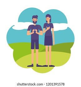 young couple using smartphone in landscape