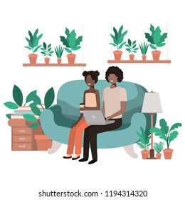 young couple using smartphone in living room