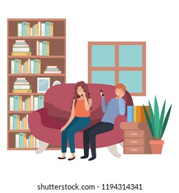 young couple using smartphone in living room