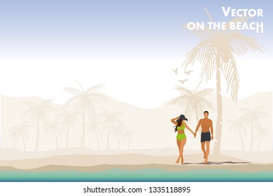 pareja joven caminando por la playa