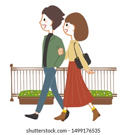 Young couple walking on the promenade