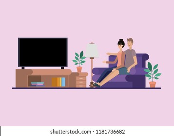 young couple watching tv on the livingroom