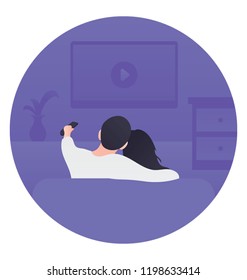 
Young couple watching tv on a sofa at home 
