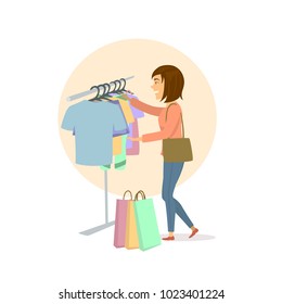 young cute excited woman choosing clothes, shopping in mall
