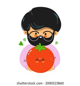 Young cute funny man hold tomato in hand. Young man hugs cute tomato. Isolated on white background
