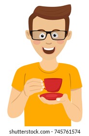 Young cute man with glasses holding cup of tea or coffee