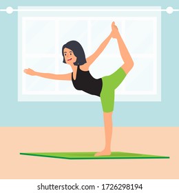 Young cute woman doing yoga at home wearing black tank top and green short legging pants.