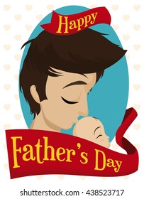Young daddy giving a loving kiss at his baby with a greeting ribbon around commemorating Father's Day.