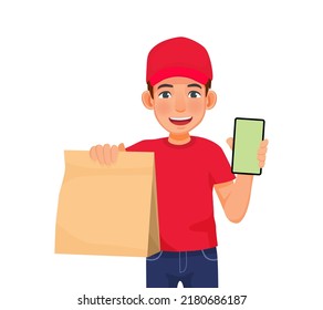 Young Delivery Man Or Courier Service With Red Cap Uniform Holding Food Package And Showing Phone With Blank Screen 