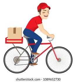 Young delivery service man on bicycle delivering cardboard package