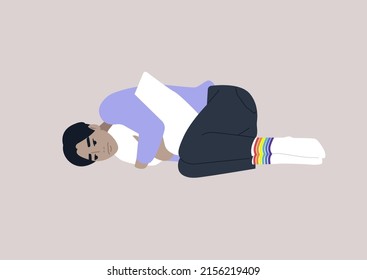 A young depressed male Asian character squeezing a pillow, Homophobia and bullying