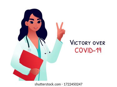 Young doctor in medical coat shows victory gesture. The concept of the end of quarantine, the pandemic, victory of the coronavirus COVID-19.