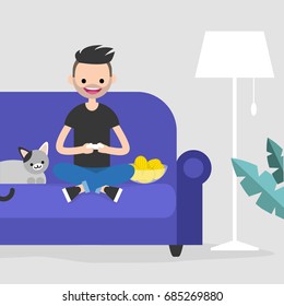 Young excited character playing video games / flat editable vector illustration, clip art
