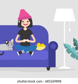 Young excited female character playing video games / flat editable vector illustration, clip art
