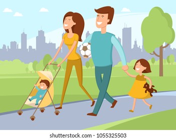 Young family with toddler and baby walking in park 