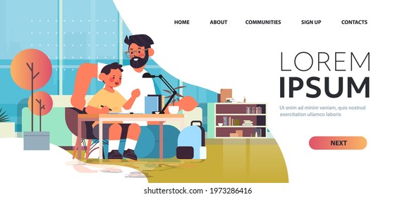 young father helping son doing homework parenting fatherhood friendly family concept living room interior