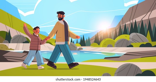 young father walking outdoor with son parenting fatherhood concept dad spending time with his kid