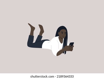 A young female African character lying on their stomach and checking their phone