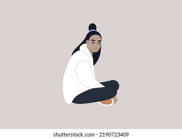 A young female Asian character sitting on the floor with their legs crossed