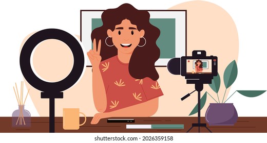 Young female blogger records herself on video using a video camera and a light lamp. Vector character creating a video review for a blog.Vlogger cartoon character records video indoors. Flat design