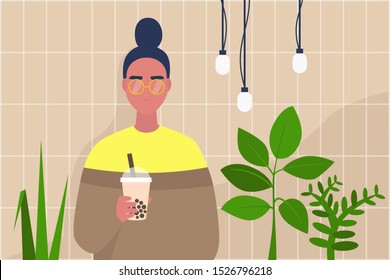 Young female character holding a cup of boba bubble tea to take away in a modern hipster interior with plants and tile pattern