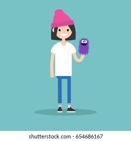 Young female character playing with a hand puppet / flat editable vector illustration, clip art