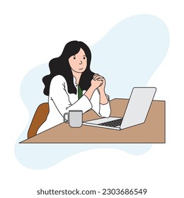 a young female doctor is using a laptop with a cup of coffee