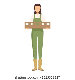 Young female farmer is holding a wooden crate, presumably full of fresh produce from her farm