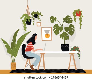 Una joven independiente está trabajando en una computadora, sentada a la mesa. Artista, diseñador, autónomo, estudiante.