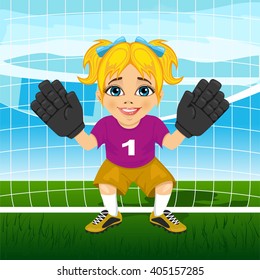 Young female goalkeeper in a ready position 