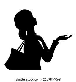 Young female silhouette looking up at threatening sky