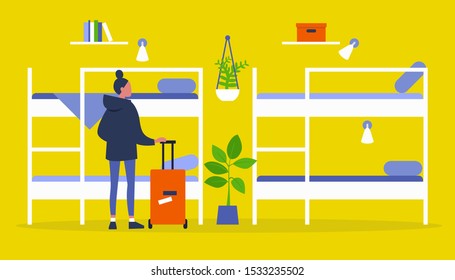 Young female traveller standing with a suitcase in a Hostel with bunk beds