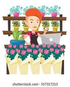 Joven florista usando teléfono y laptop para tomar orden. Florista parada detrás del mostrador en la floristería. Mujer trabajando en una floristería. Ilustración de diseño plana vectorial aislada en fondo blanco.