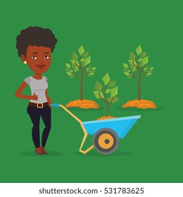 Jóvenes jardineros empujando carretillas con árbol y suciedad en el parque. Un jardinero afroamericano con carretilla sobre un fondo de árboles recién plantados. Ilustración de diseño plana vectorial. Diseño cuadrado.