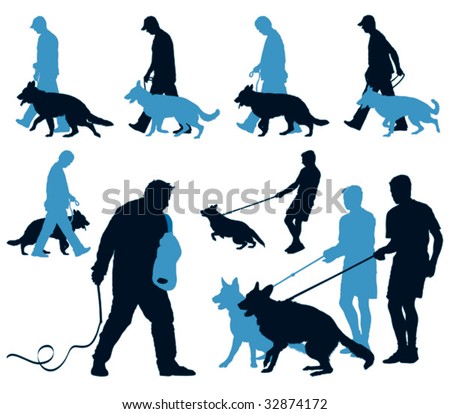 Young German Shepherd dogs at work at the dog school with their leaders