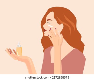 A young girl applies a cosmetic product to her face. girls have a bottle of cosmetics, cream, face serum in her hand. Beauty procedures. Cosmetic packaging, mask cream, serum bottle with retinol.