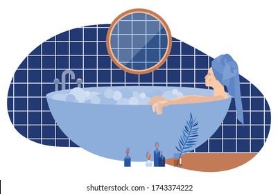 
Young girl in a bath with foam. Blue bathroom. Spa therapy at home. Relaxation. Keep calm and stay home.