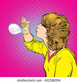 Young girl blowing soap bubbles